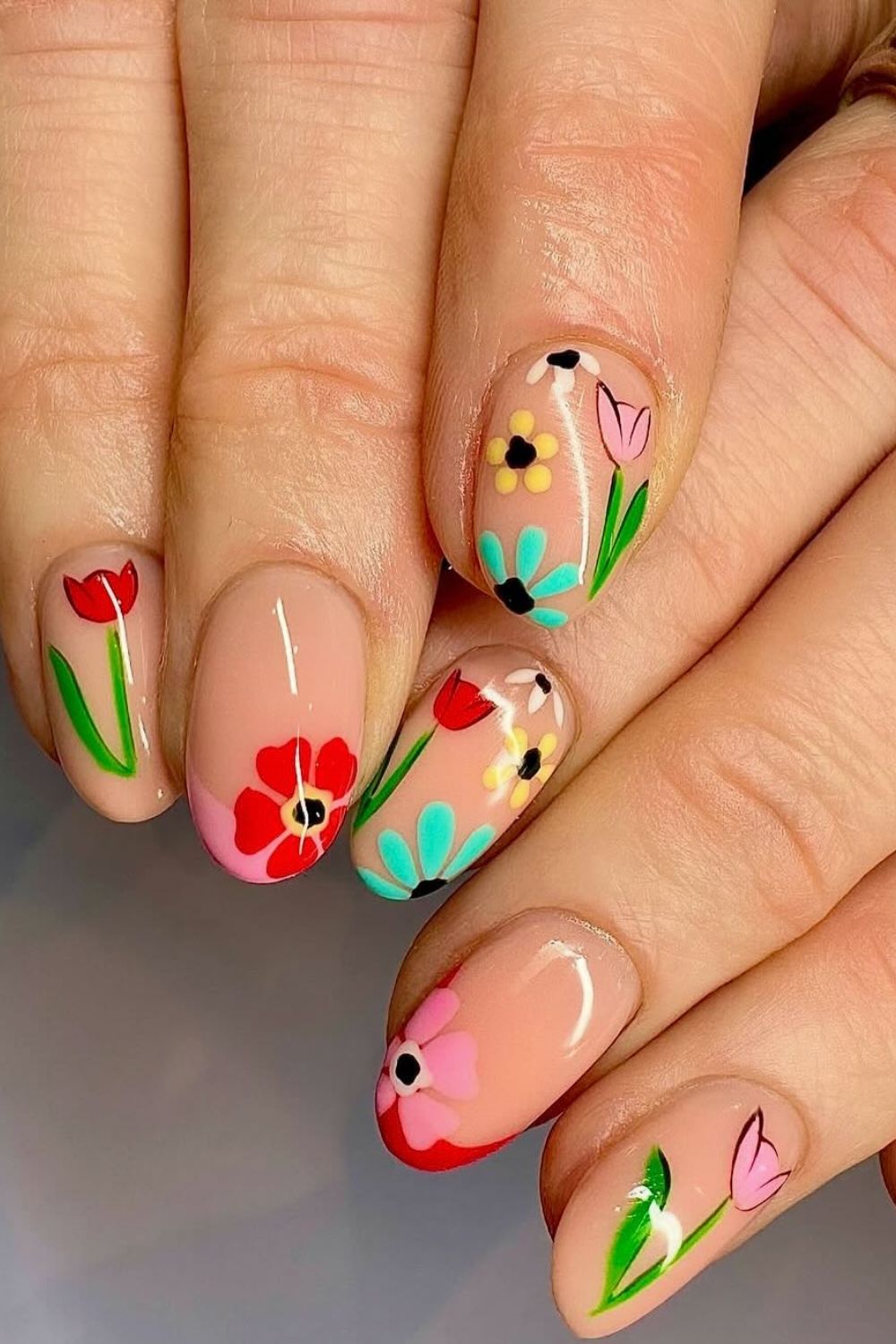 Colorful floral nail art with vibrant flowers