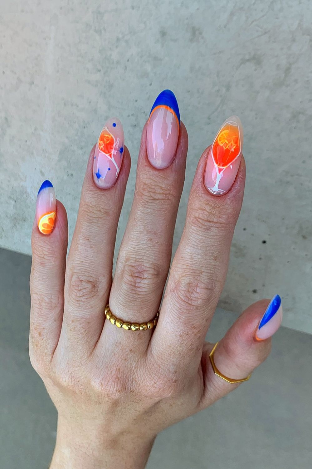 Neon sunset nails with blue and orange tips