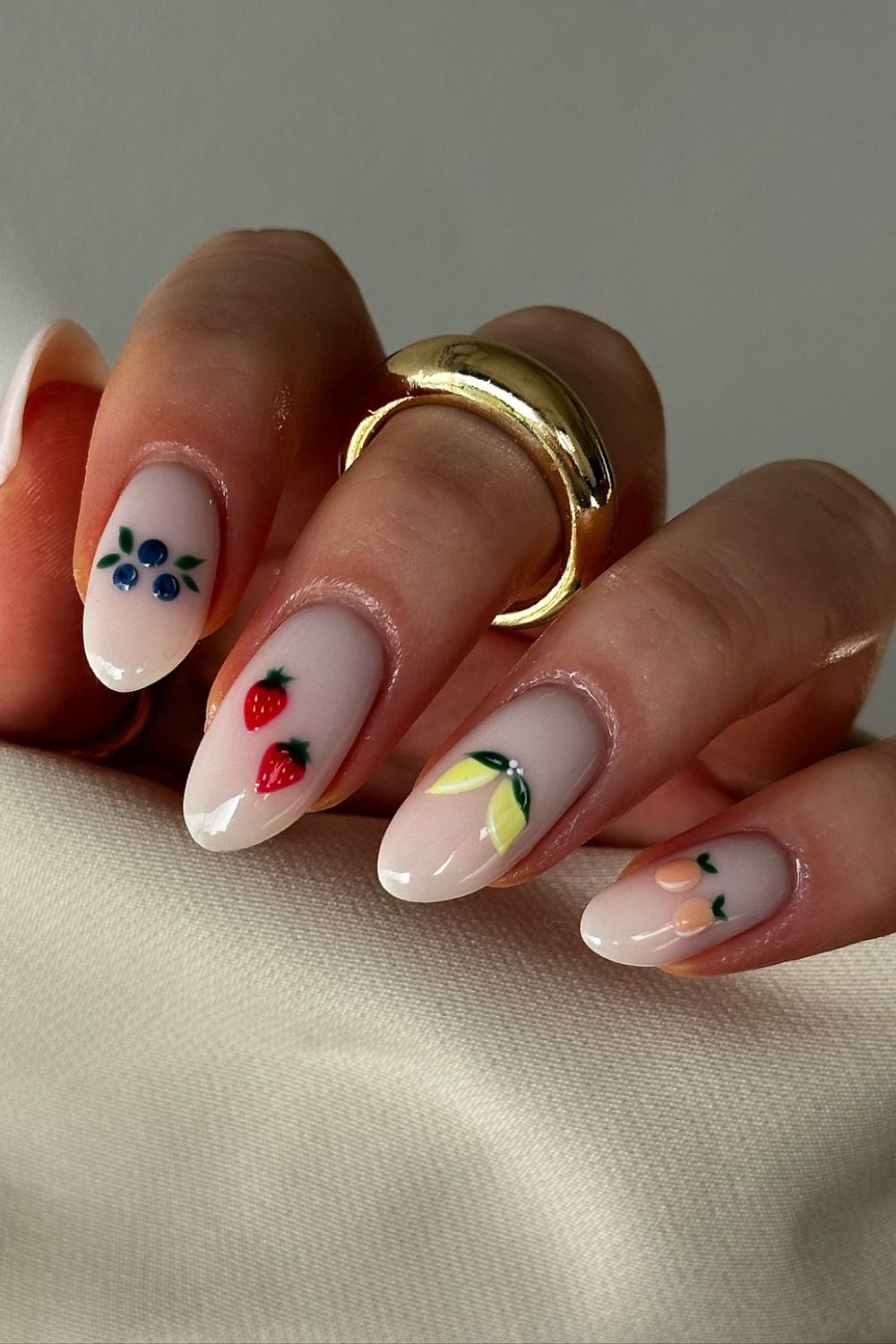 Nude nails with fruit and floral designs