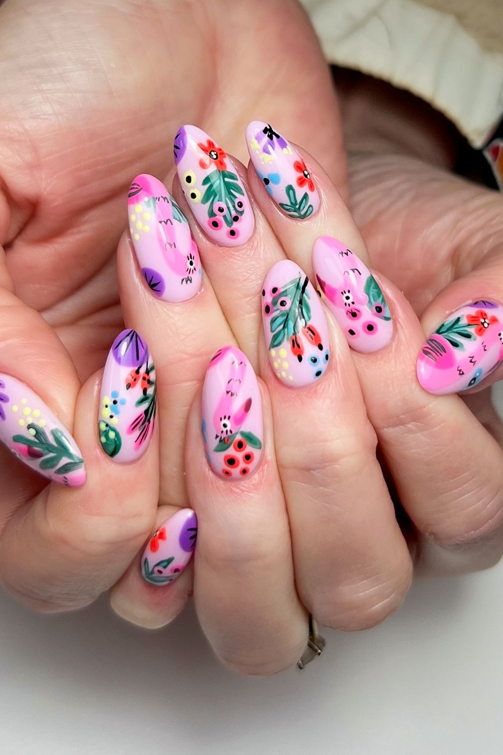 Pink nails with colorful floral art