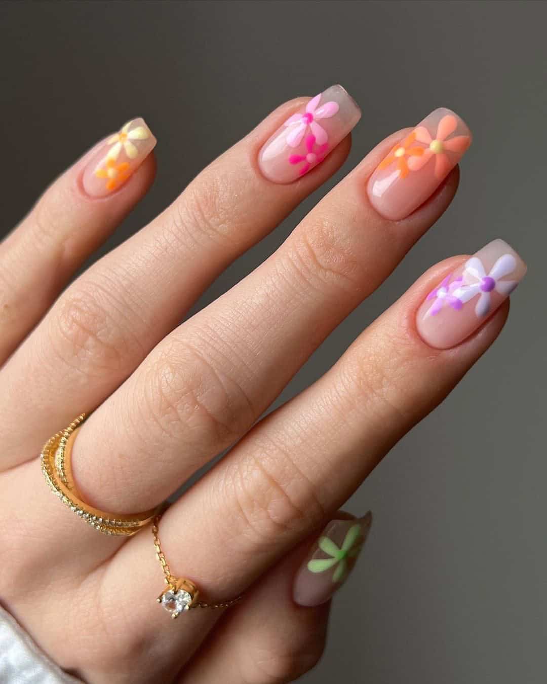Colorful floral square nails with neon accents, playful summer nails