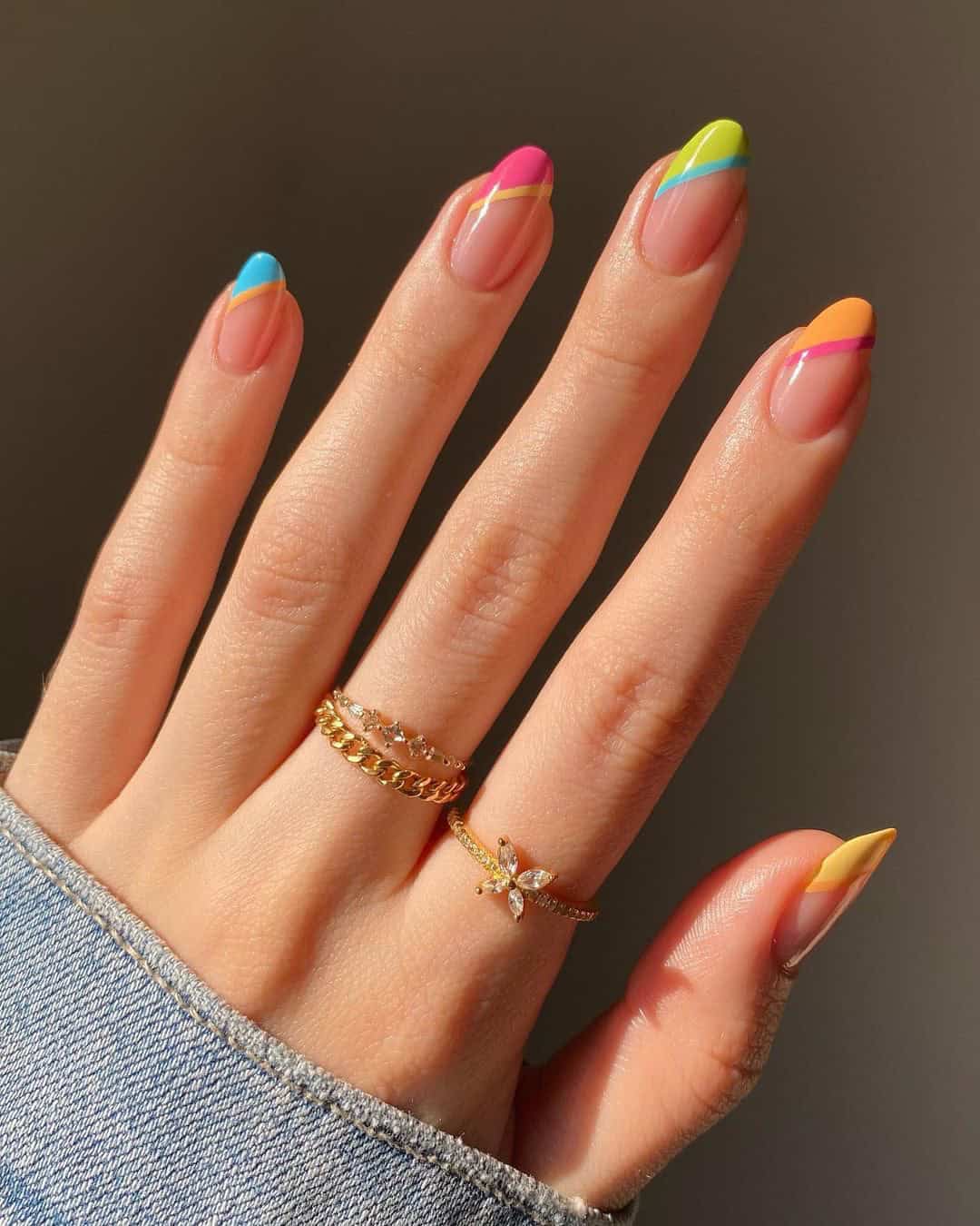 Colorful French tips with neon accents, playful nail art