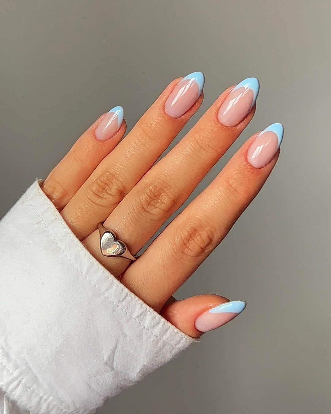 Pastel blue French tips, almond shape