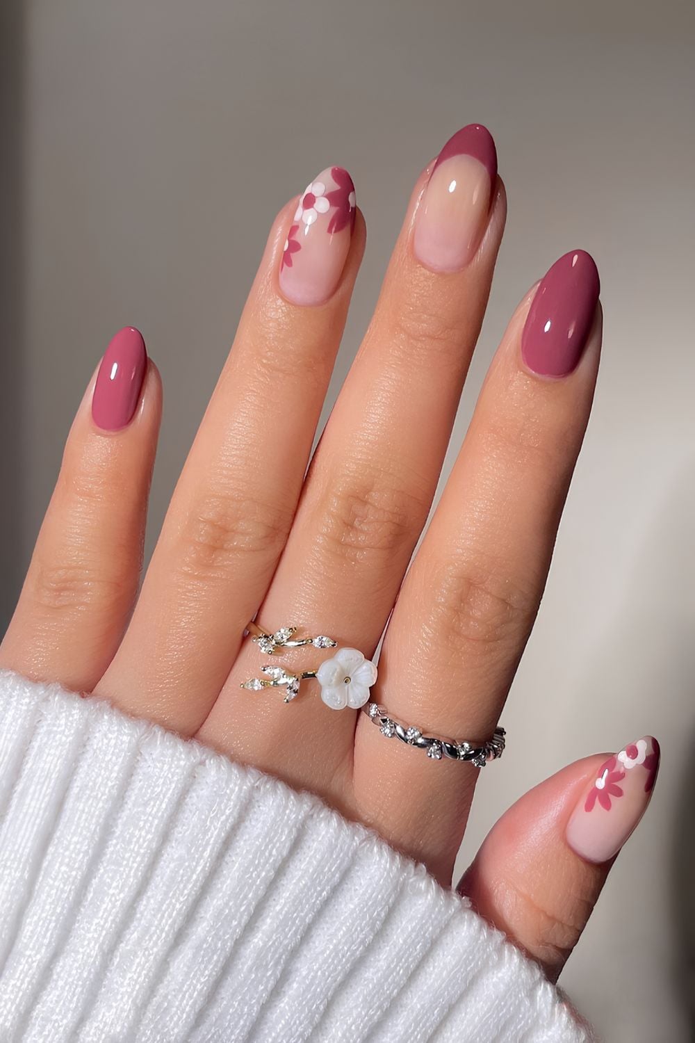 Berry nails with floral accents, almond shape, feminine and fresh.