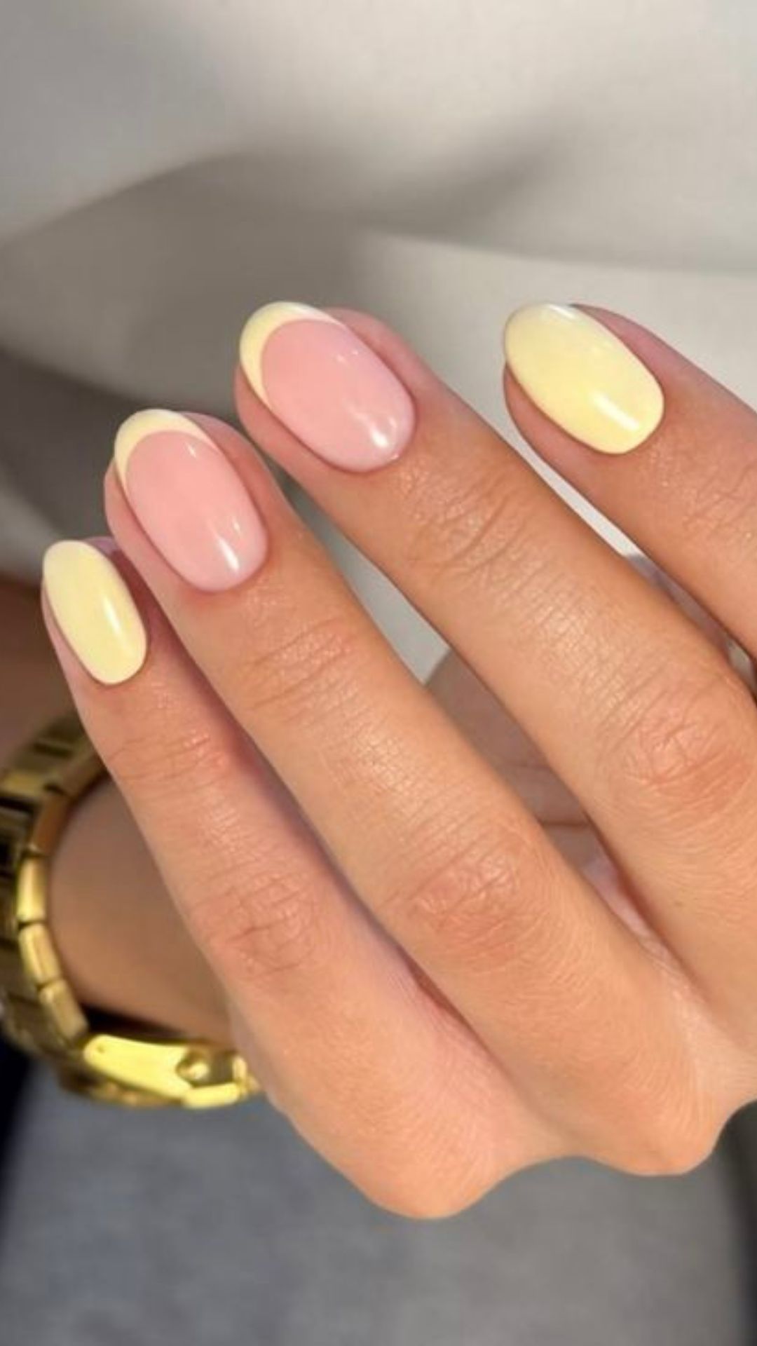 Pink and yellow pastel oval nails, fresh and playful.