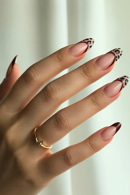 Leopard print French tips, bold and trendy.