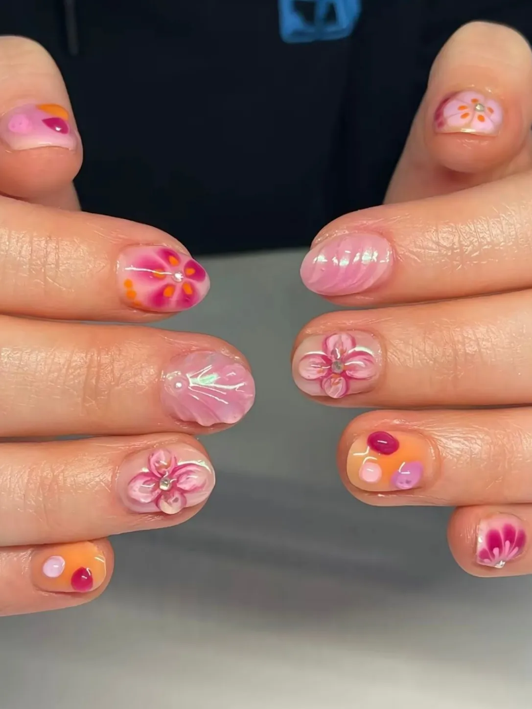 Playful floral nail art with vibrant colors and Pinterest-friendly design.