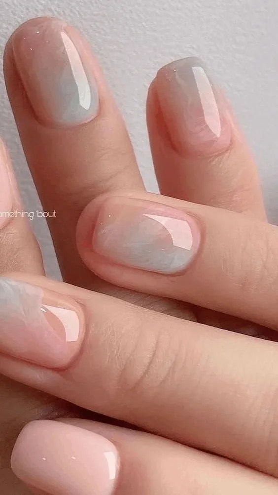 Soft marble nails in pastel hues, ideal for Pinterest marble trends.