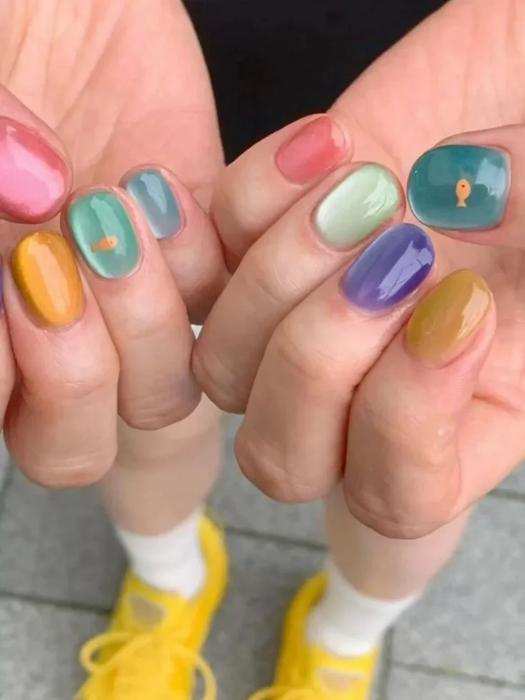 Rainbow mosaic nails with a playful palette.