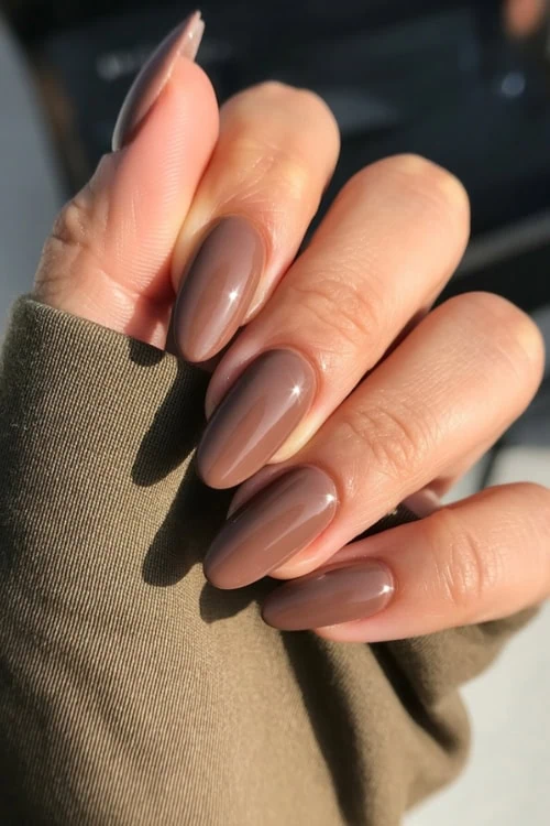 Mocha brown nails with glossy finish.