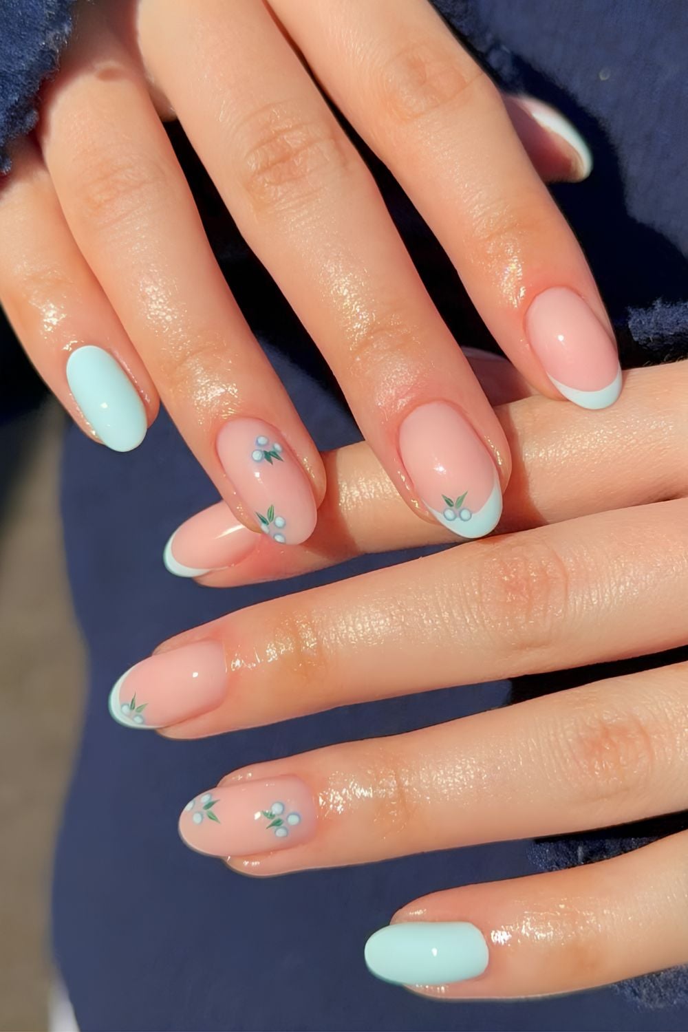 Pastel French tips with delicate floral accents.