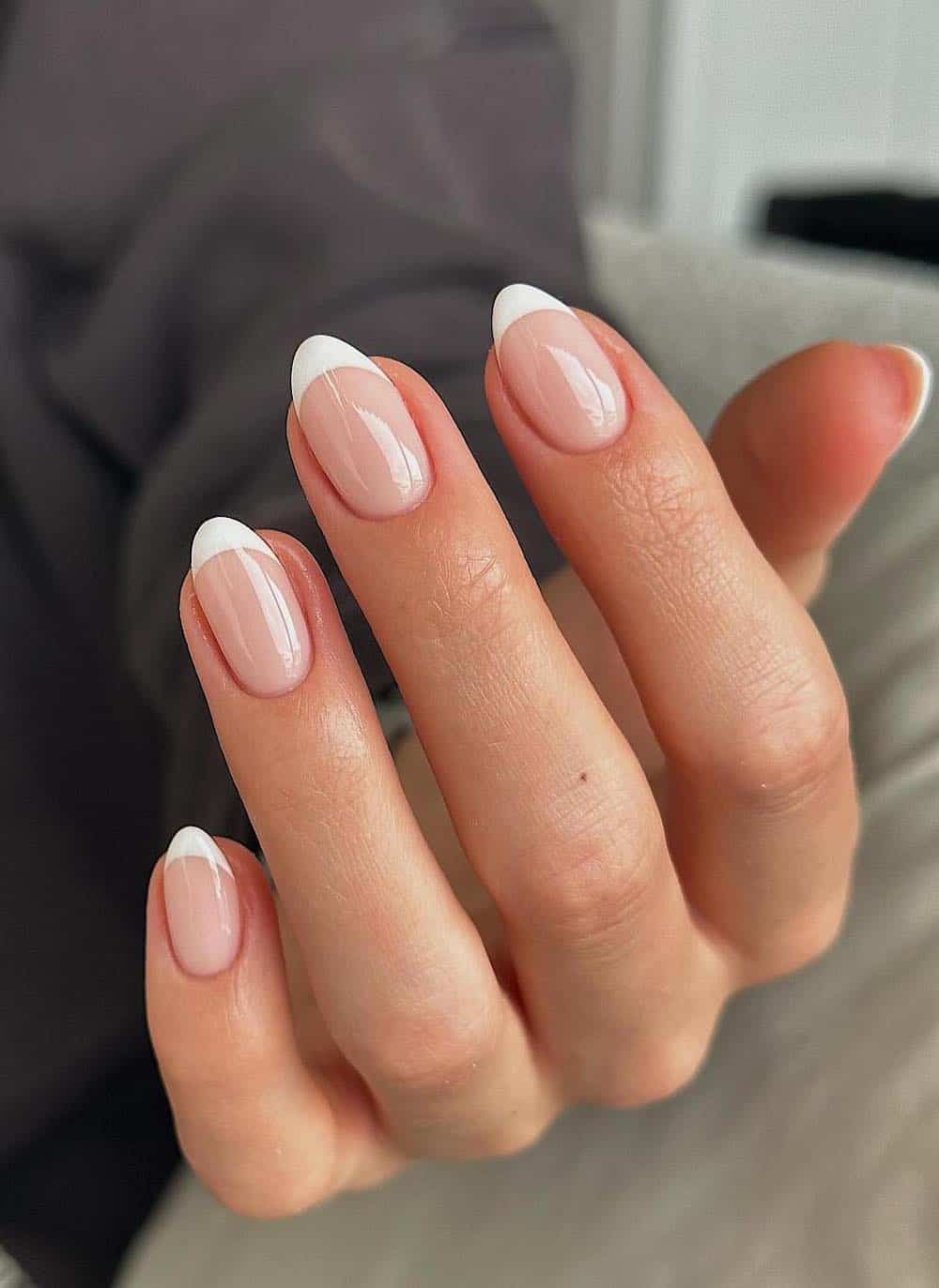 Classic French almond nails, timeless and chic.