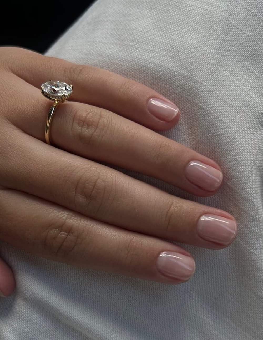 Sheer nude almond nails, simple elegance.