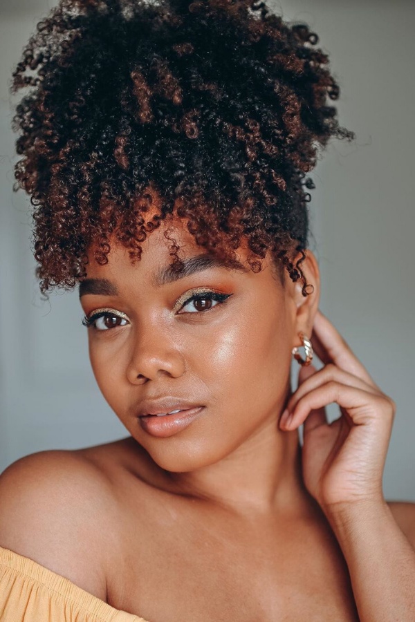 Cascading curls with copper highlights