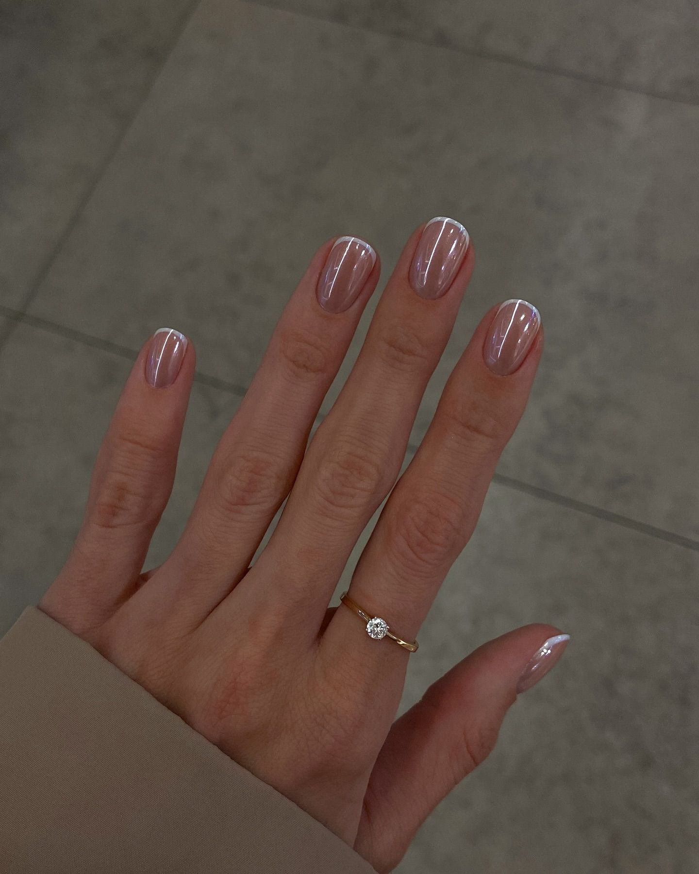 Micro French manicure with a glossy finish on short nails