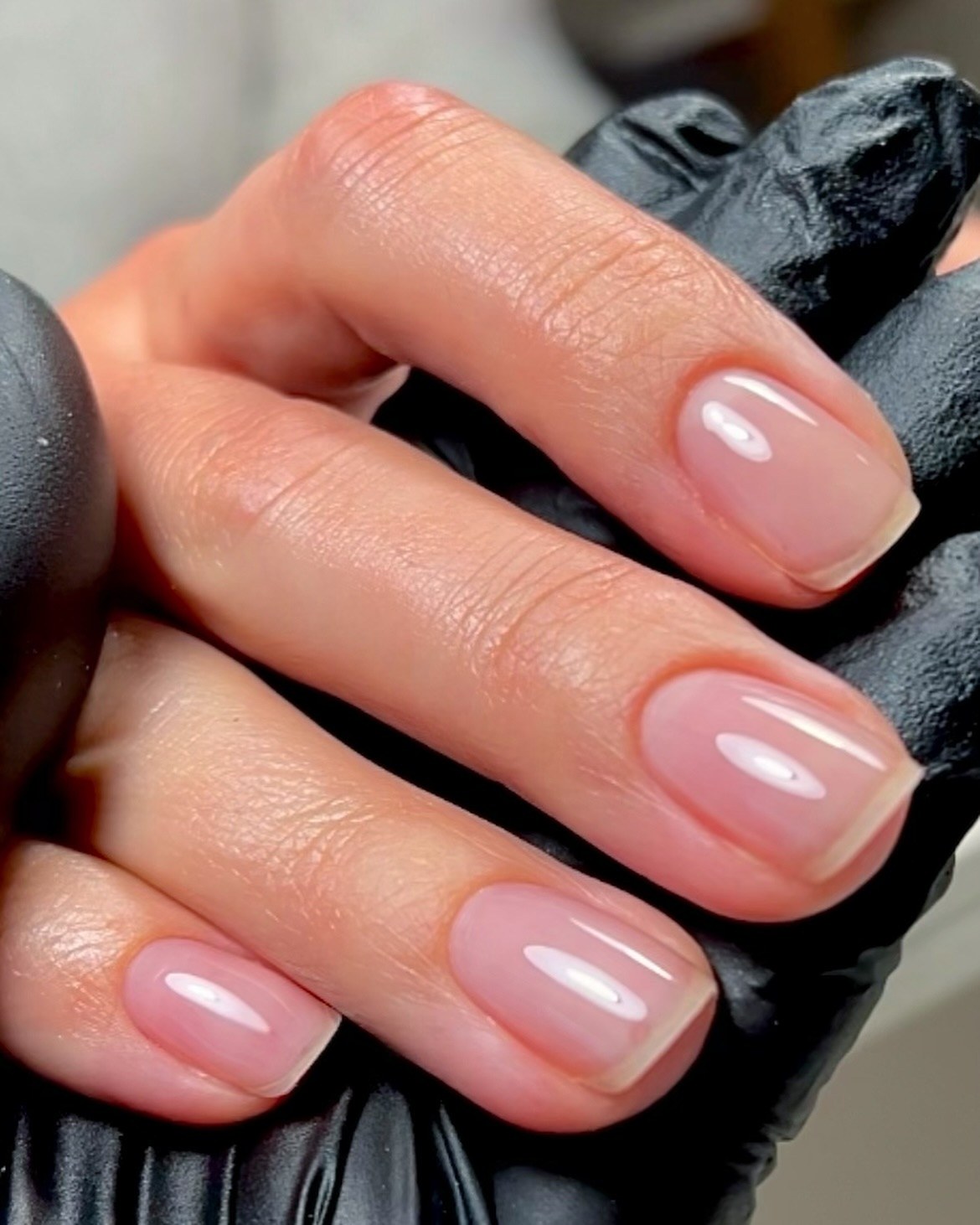 Natural pink nails with a glossy finish