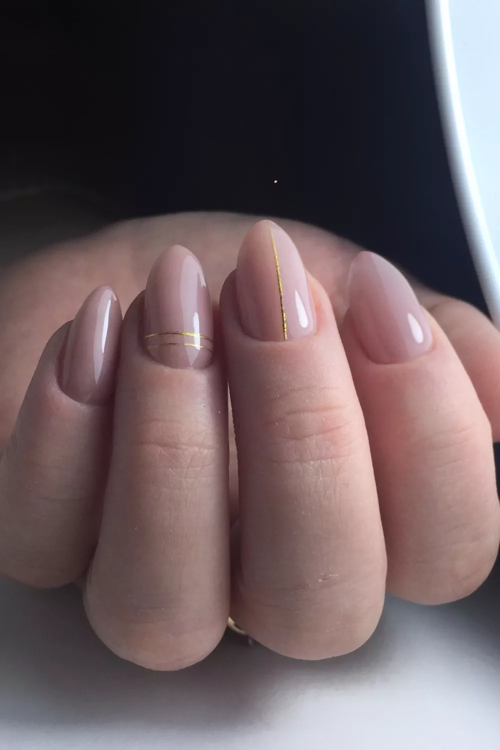 Gold line nail art with a chic finish