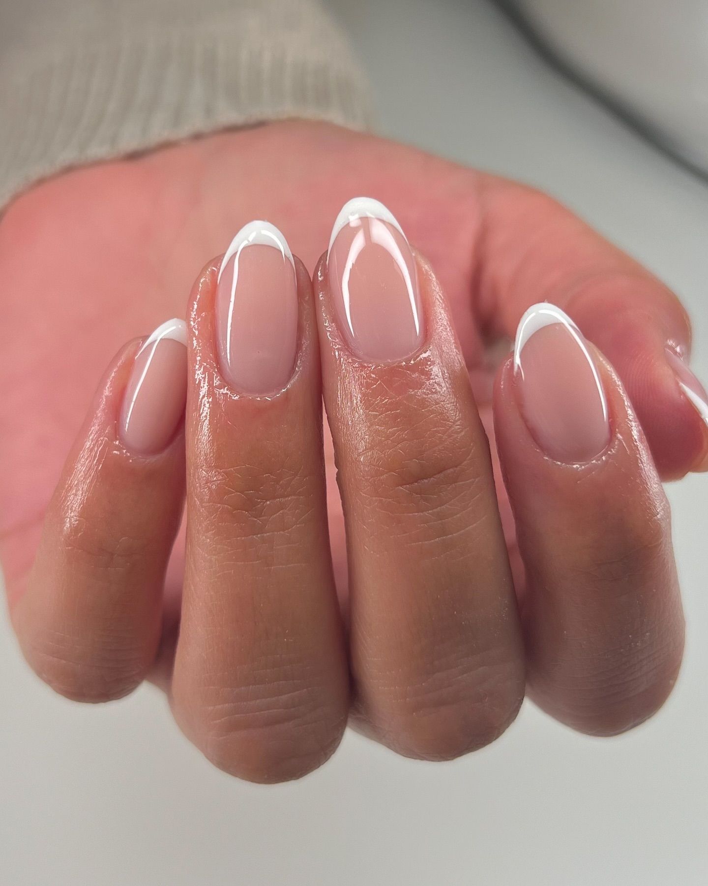 Elegant white tip nails with a soft touch