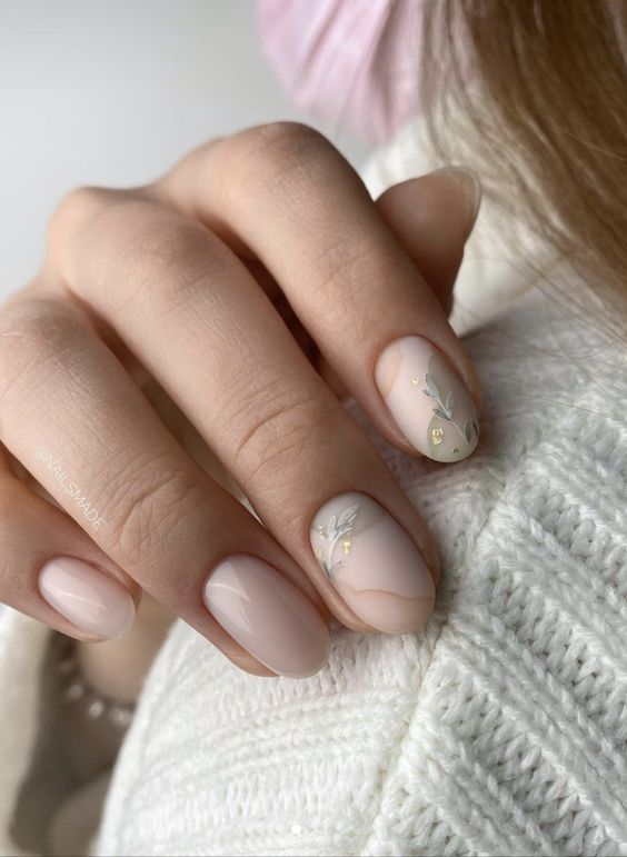 Soft nude nails with leaf accents