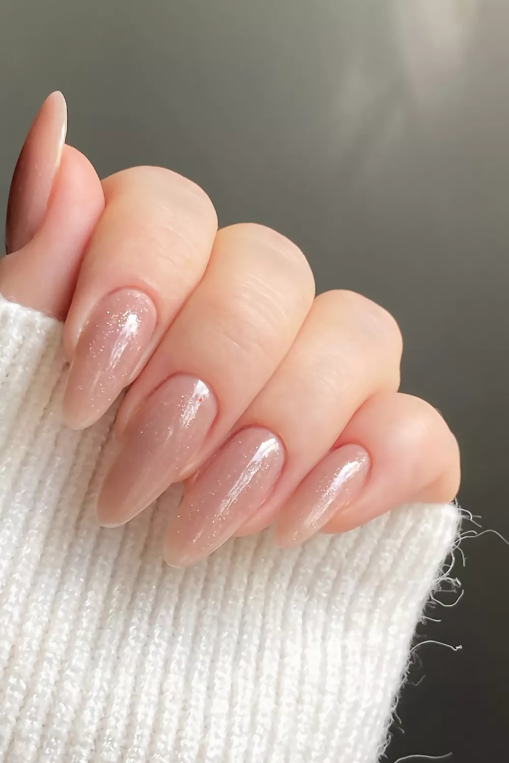 Almond nails with shimmering nude polish