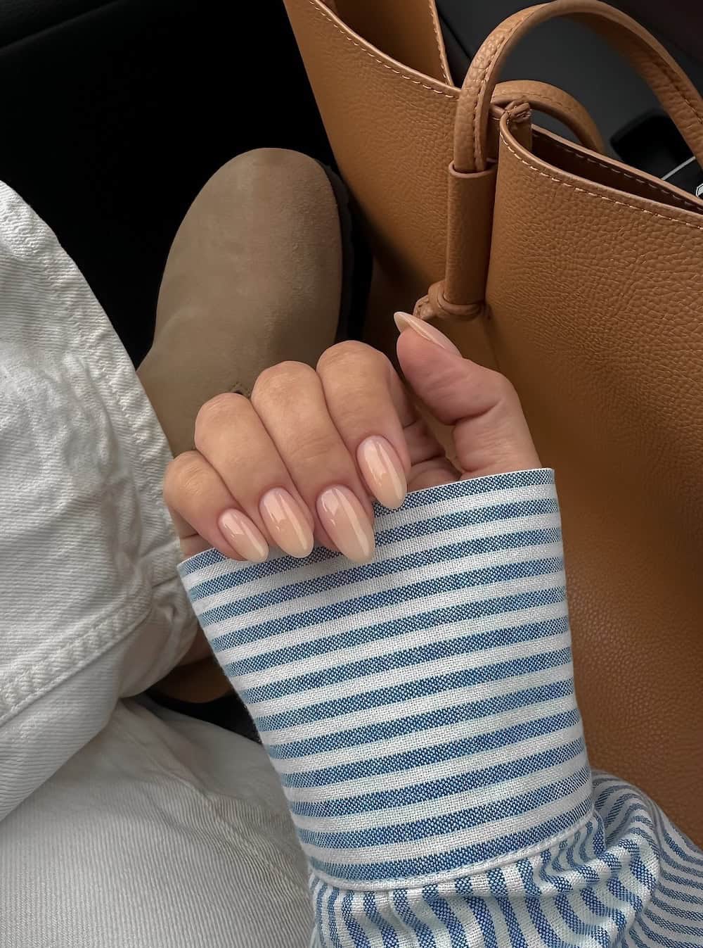 Glossy nude almond nails