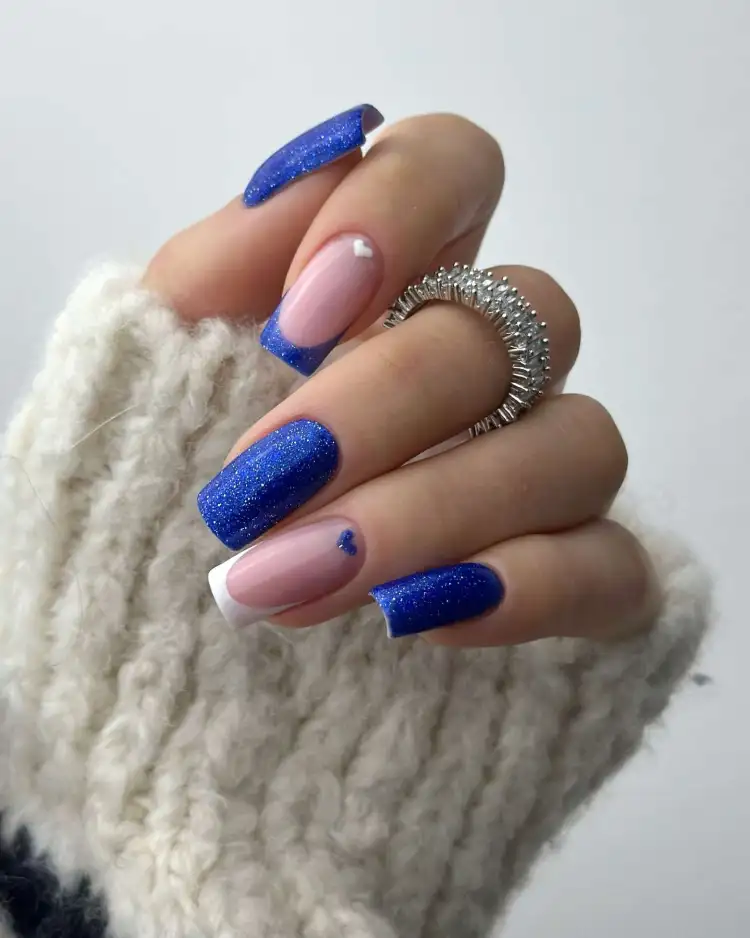 French tips with navy glitter, sparkling and elegant.