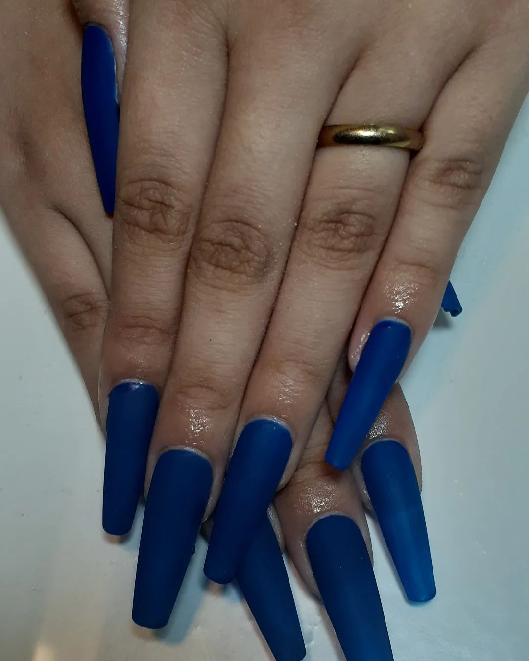 Matte navy coffin nails, bold and dramatic.