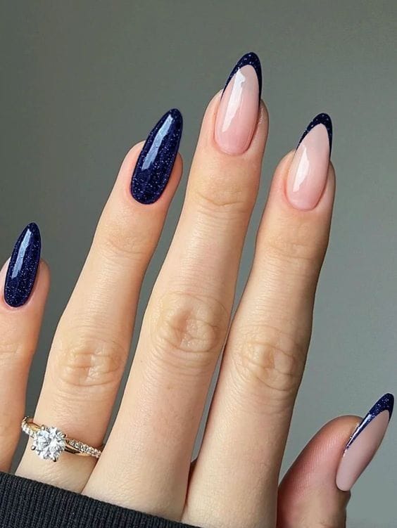 Glitter navy French tips, sparkling and sophisticated.