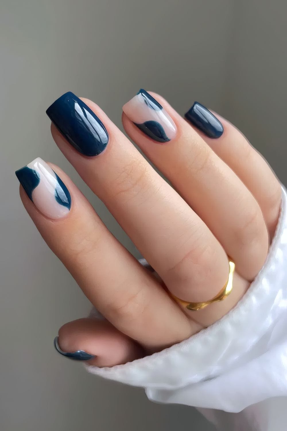 French manicure with navy twist, classic and bold.