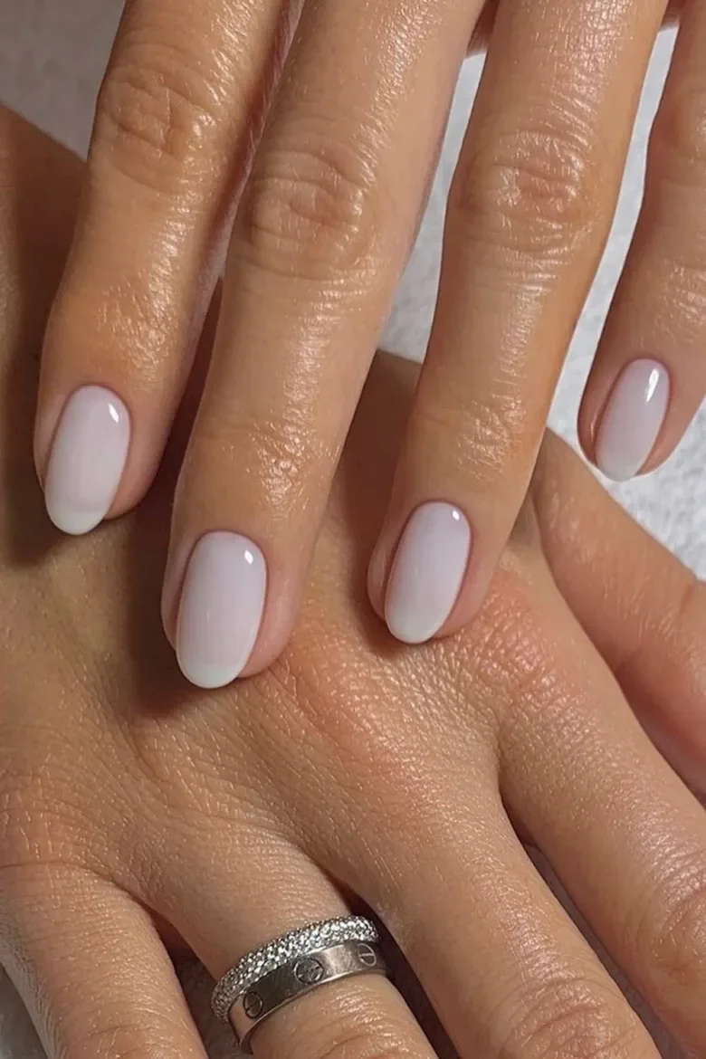 Milky neutral nails, short oval, elegant simplicity