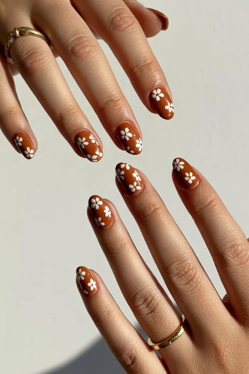 Daisy nail art, almond shape, playful elegance