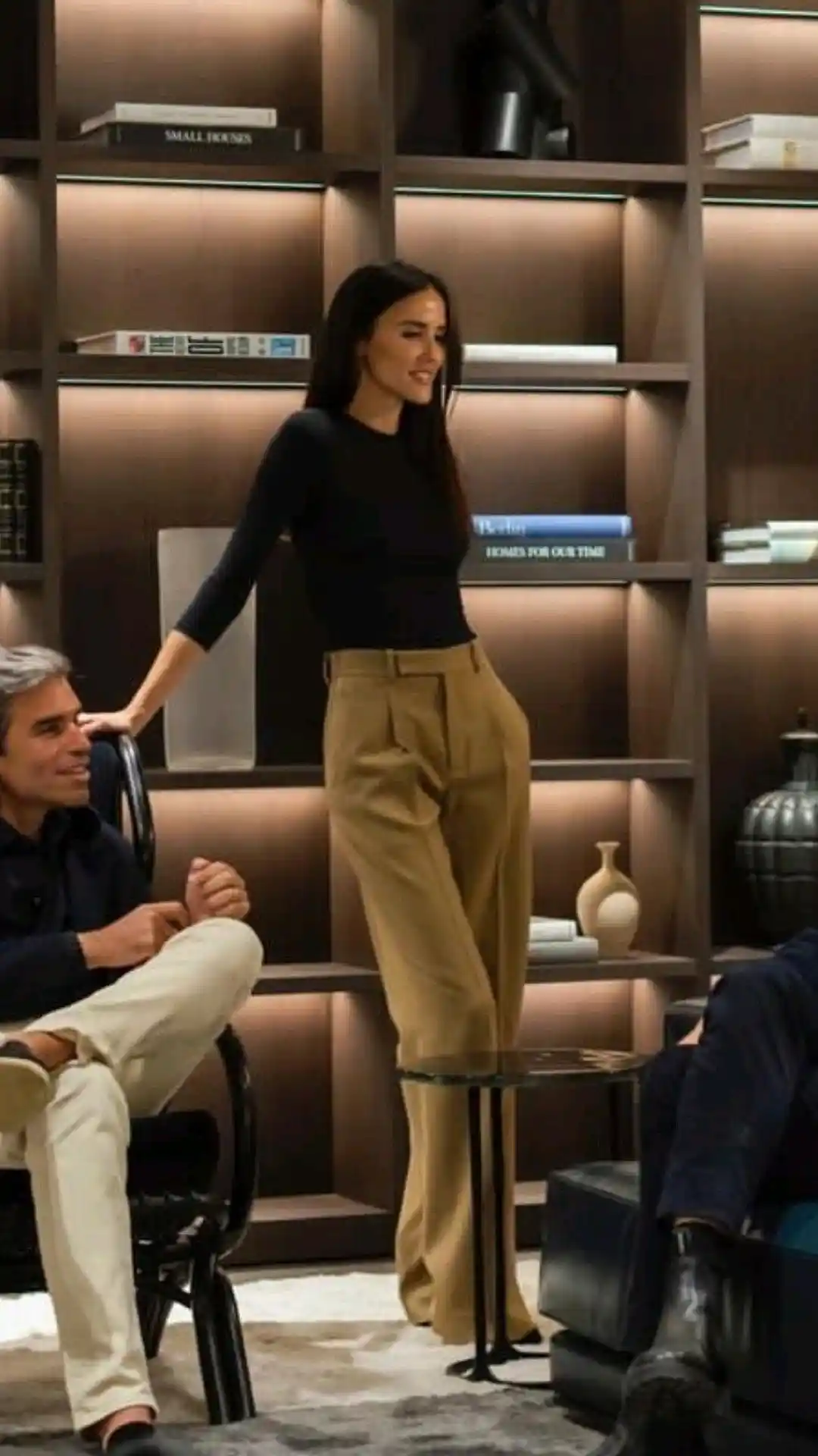Black top with camel trousers for smart casual look