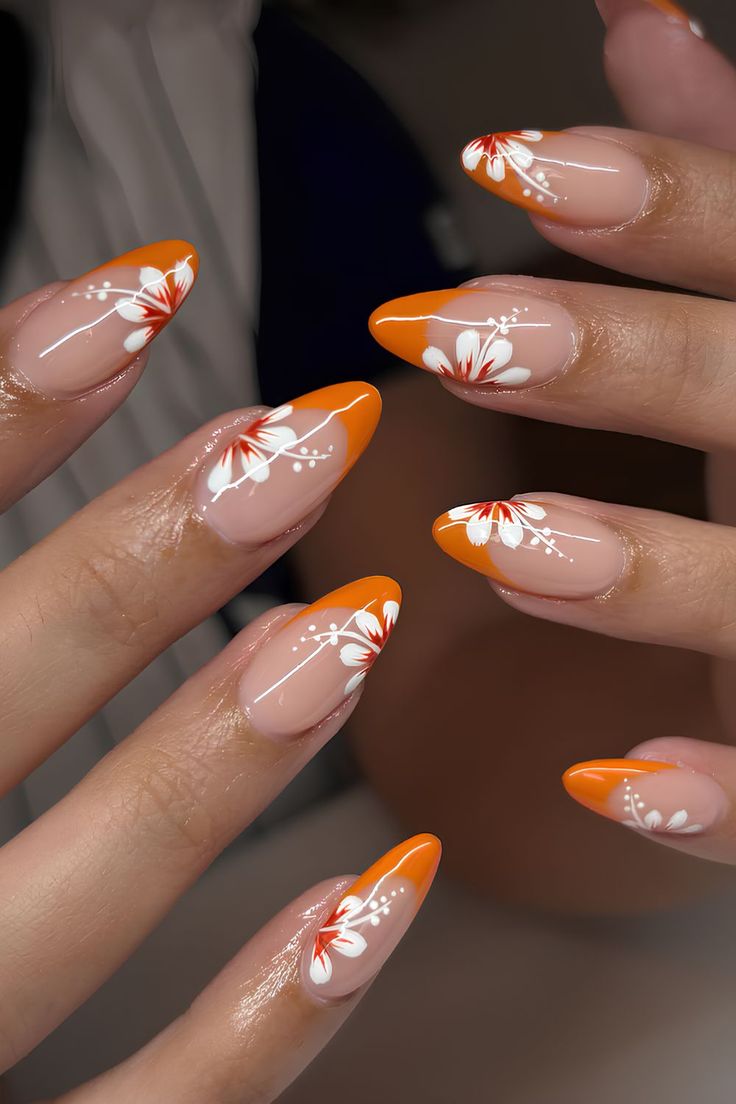 Orange French tips with floral design