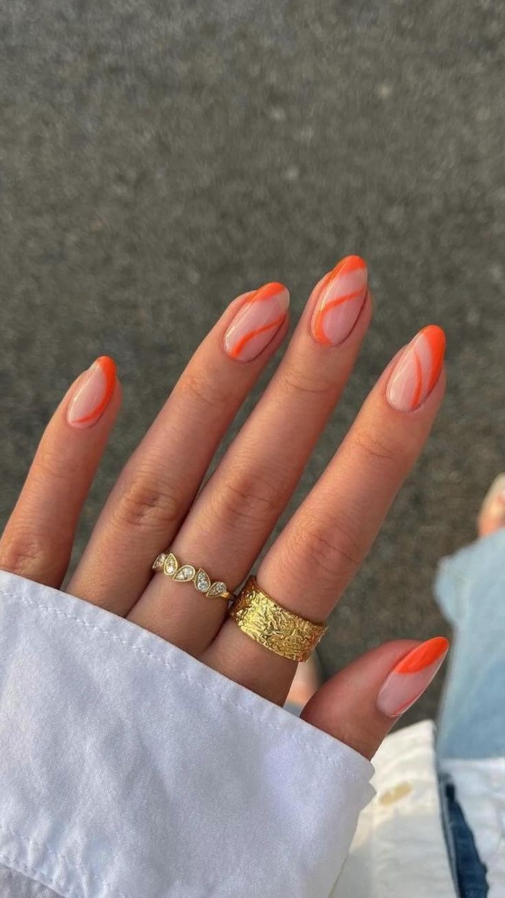 Orange and nude nails with swirls