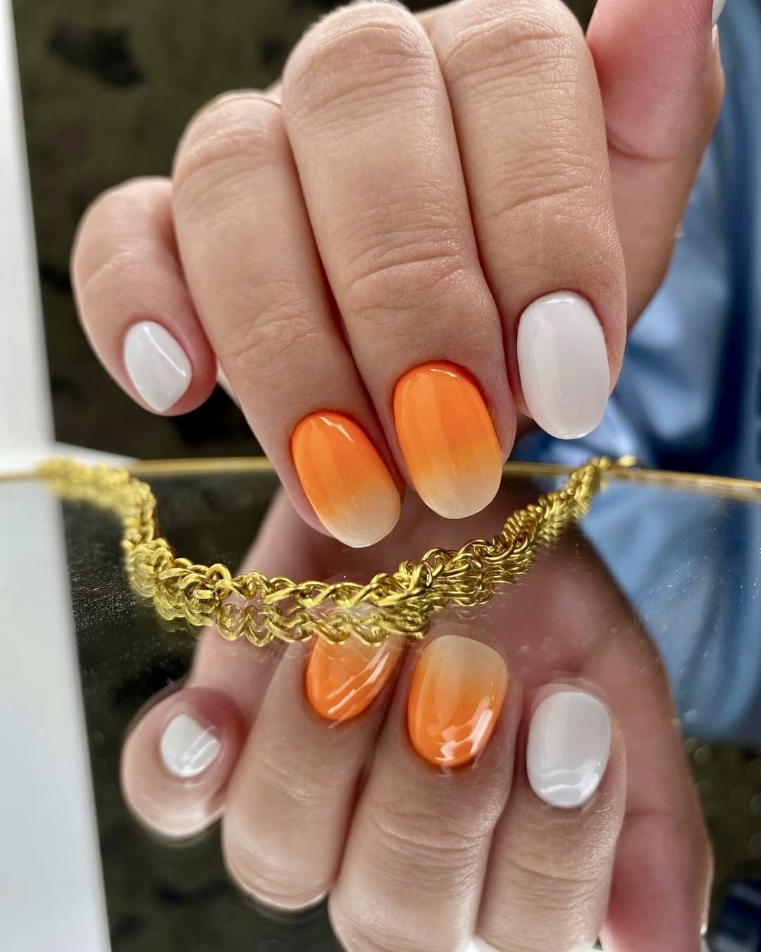 Orange ombre nails with white base