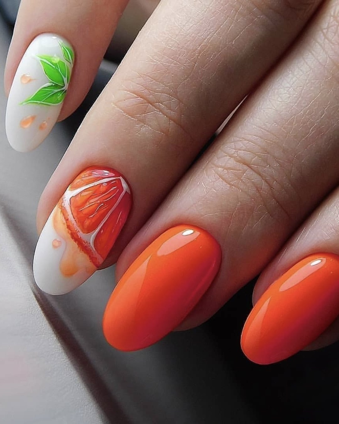 Orange nails with citrus fruit art