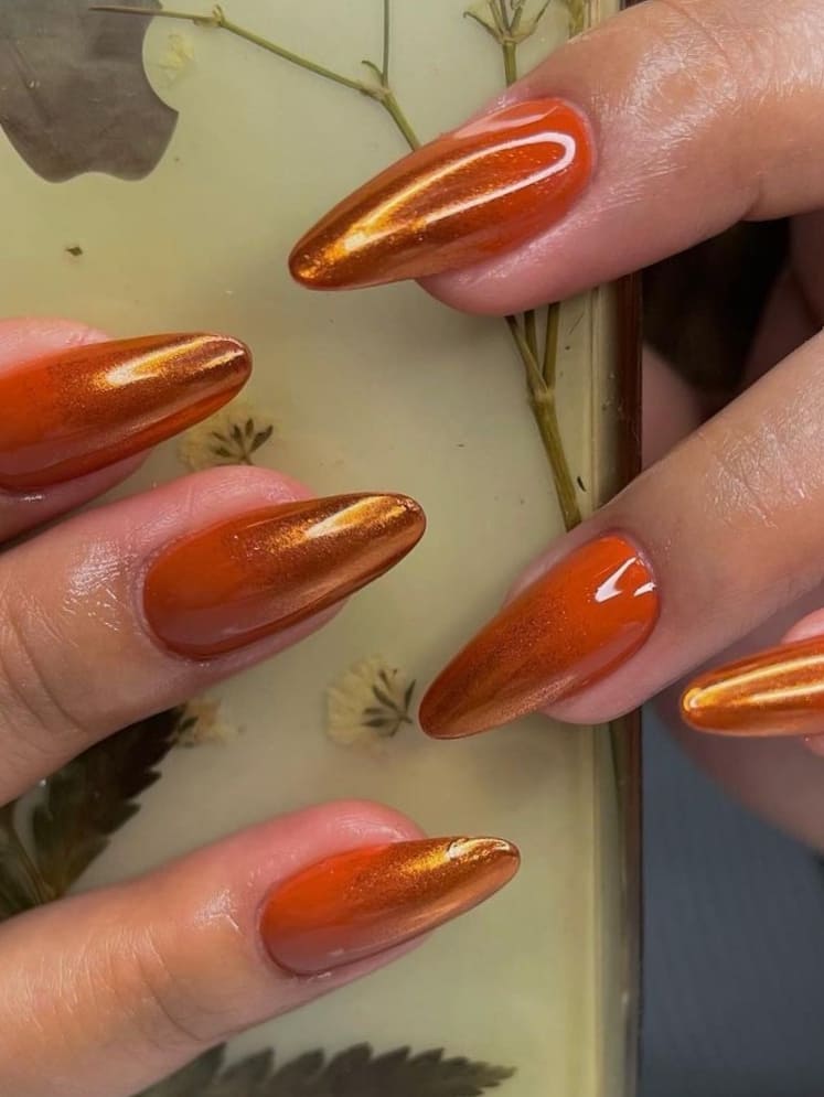 Metallic burnt orange stiletto nails