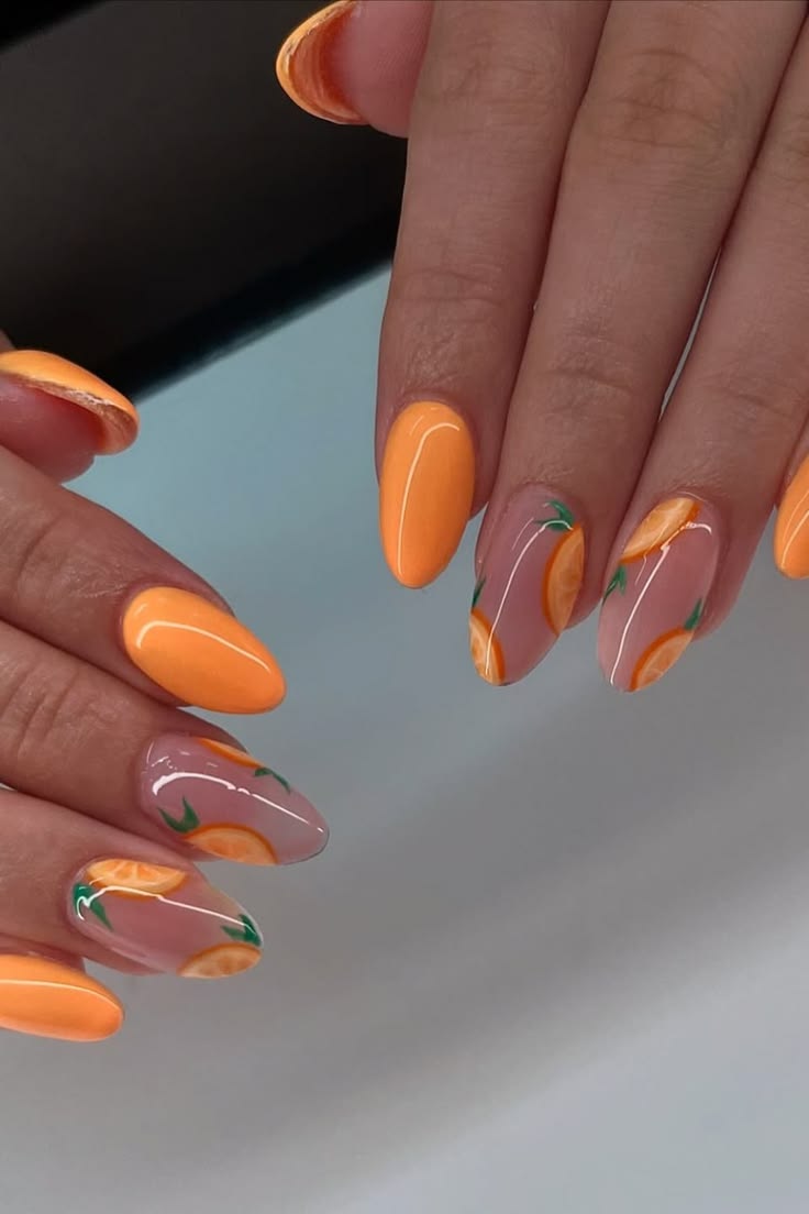 Orange and peach nails with floral design