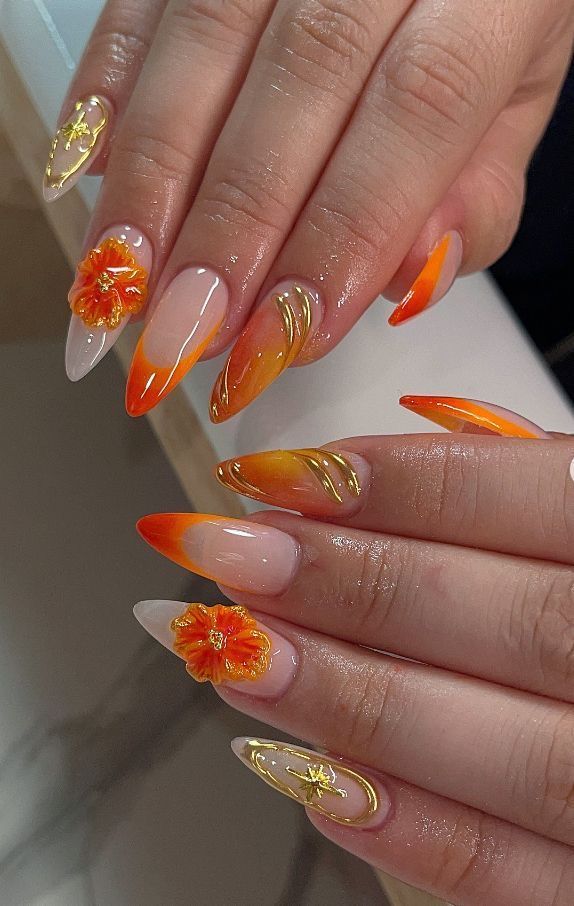 Orange stiletto nails with florals
