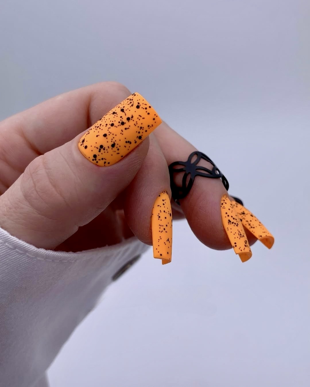 Speckled orange matte coffin nails
