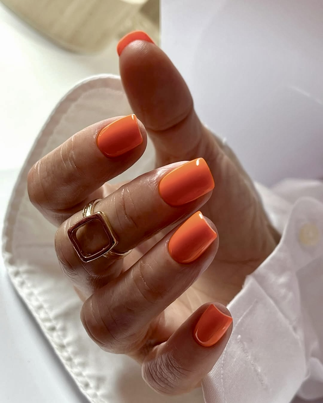 Bright orange glossy square nails