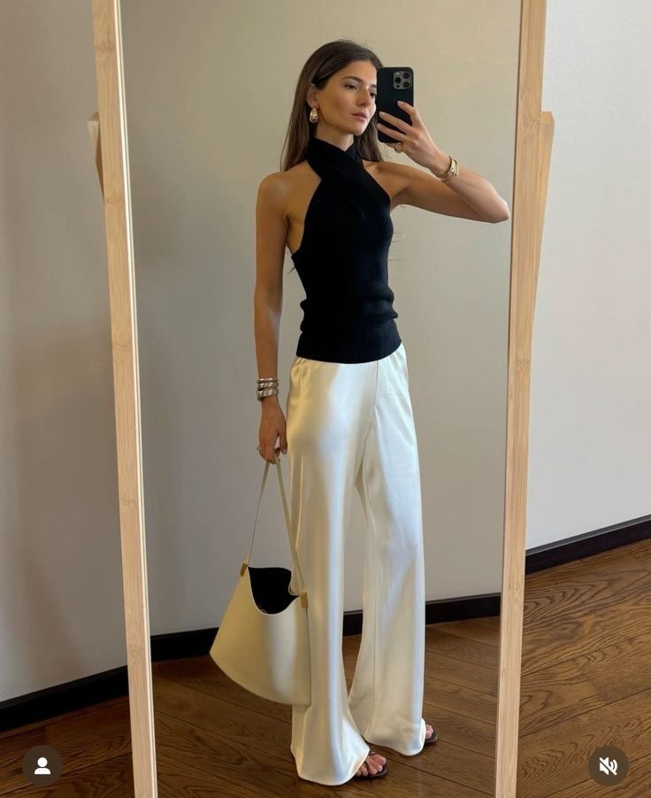 Black halter top with white satin trousers