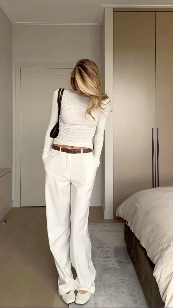 White top and trousers with belt