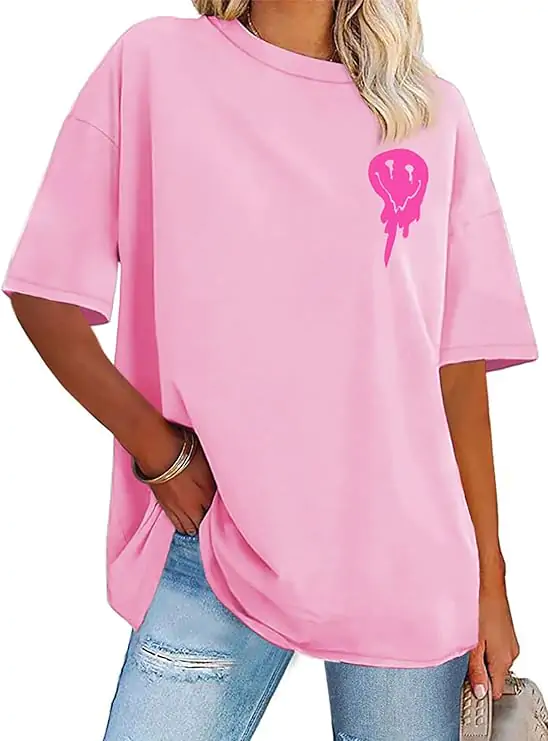 Pink graphic tee with distressed jeans, vibrant school outfit
