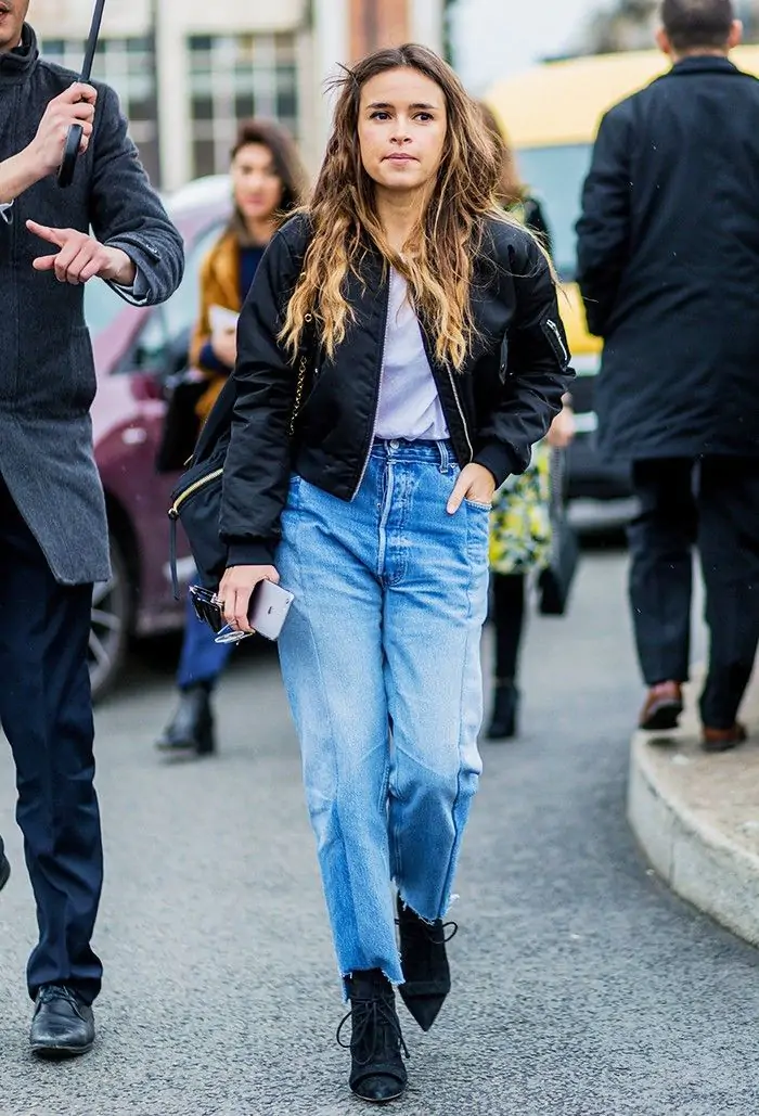 Bomber jacket with high-waisted jeans, street-style school outfit