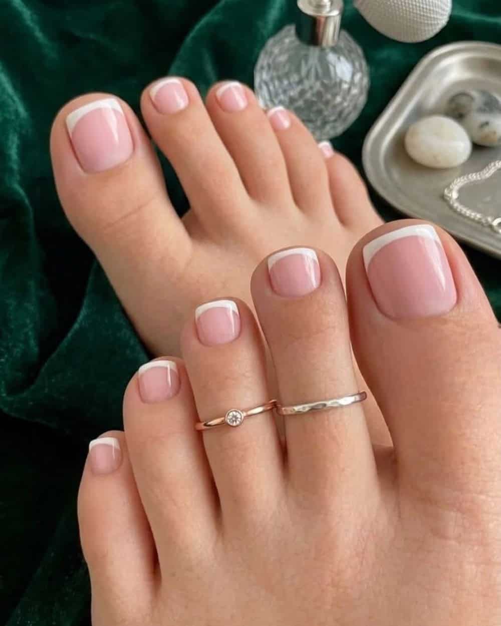 Classic French pedicure with pink base and white tips