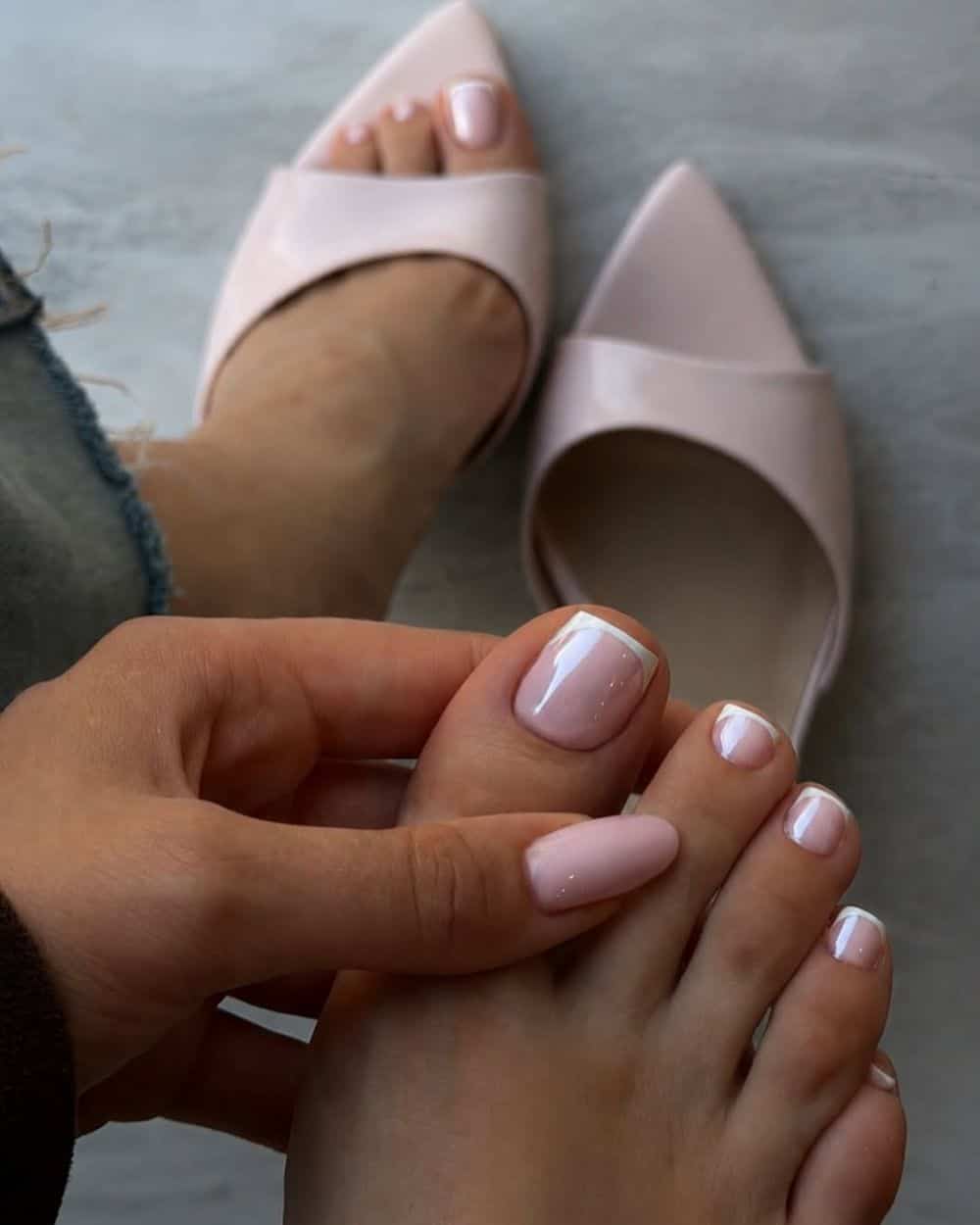Soft pink pedicure with glossy finish on square nails