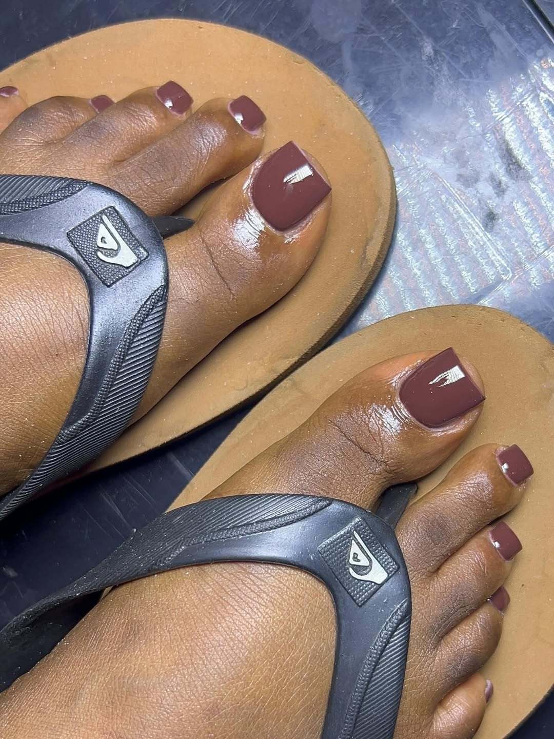 Chocolate brown pedicure with glossy finish