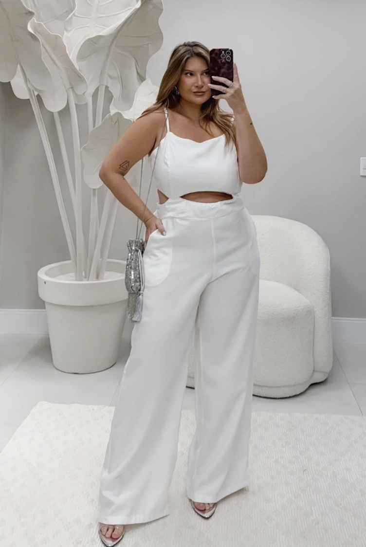 plus size white cutout jumpsuit with silver bag