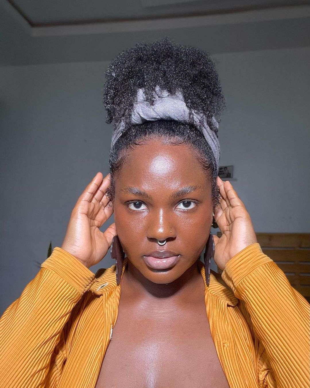 Pineapple updo with headband for natural curls